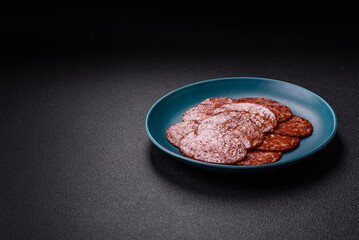 Delicious smoked pepperoni sausage sliced with salt, spices and herbs