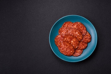 Delicious smoked pepperoni sausage sliced with salt, spices and herbs