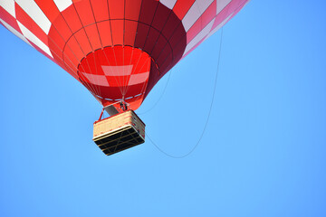 Fototapeta premium Red hot Air balloon on the clear blue sky background