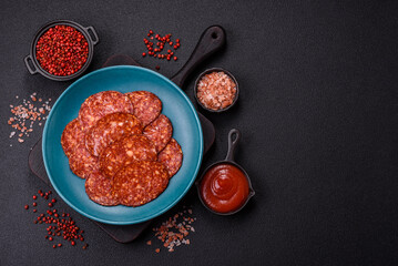 Delicious smoked pepperoni sausage sliced with salt, spices and herbs