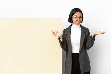 Young business mixed race woman with with a big banner over isolated background having doubts while raising hands