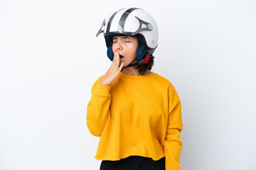 Woman with a motorcycle helmet yawning and covering wide open mouth with hand
