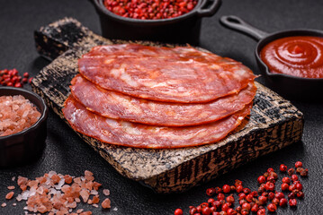 Delicious smoked meat sliced with salt, spices and herbs