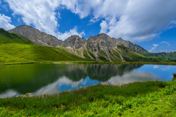 Fototapeta premium Oberpartnom See, Stein in the Gross Walsertal, State of Vorarlberg, Austria