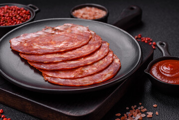 Delicious smoked meat sliced with salt, spices and herbs