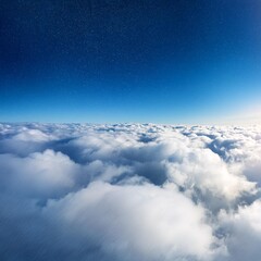 Sun rays shinning in the blue sky with layer of clouds viewed from above.