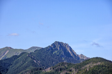 Obraz premium mountain landscape with several mountain peaks and blue sky