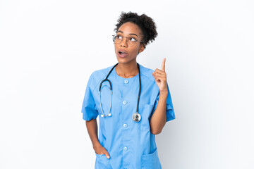 Young surgeon African American doctor woman isolated on white background thinking an idea pointing...