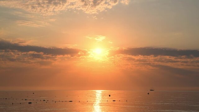 Beautiful sunset or sunrise on the sea, sky with clouds, natural delicate background