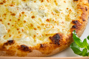 pizza four types of cheese mozzarella, blue cheese, camembert and cheddar fresh meal food snack on the table copy space food background rustic top view