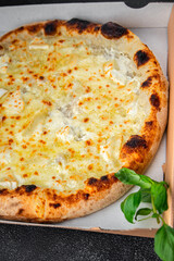 pizza four types of cheese mozzarella, blue cheese, camembert and cheddar fresh meal food snack on the table copy space food background rustic top view