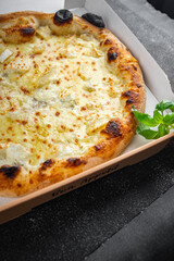 pizza four types of cheese mozzarella, blue cheese, camembert and cheddar fresh meal food snack on the table copy space food background rustic top view