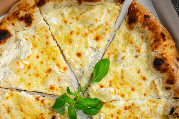 pizza four types of cheese mozzarella, blue cheese, camembert and cheddar fresh meal food snack on the table copy space food background rustic top view
