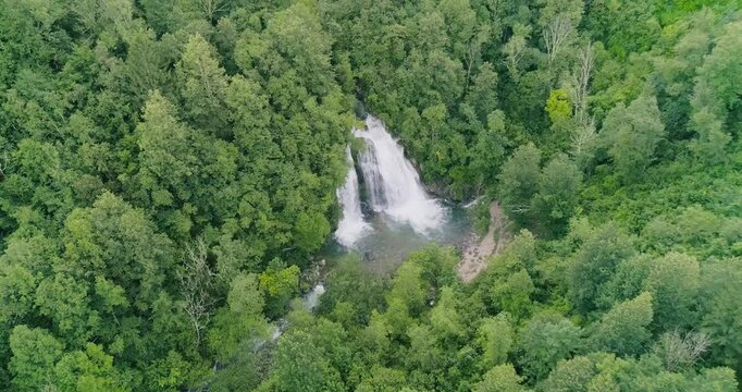 Aereal drone viewBovec, Slovenia. Visje waterfalls. Nature trail crystal clear, turquoise water., nature experience, wood path. Waterfalls inside a forest, power of nature.