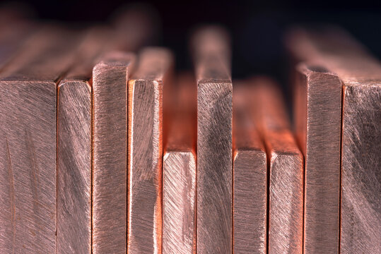 Row of copper flat bars close-up view
