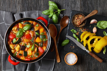 hearty italian vegetable stew in red pot, top view