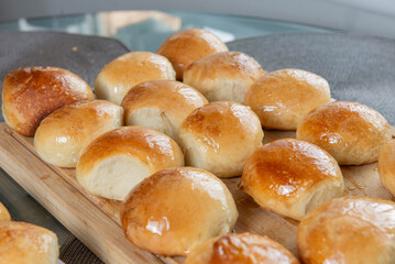 Freshly baked burger buns close up. Freshly baked buns home baking. Handmade.