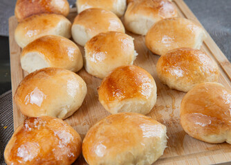 Freshly baked burger buns close up. Freshly baked buns home baking. Handmade.