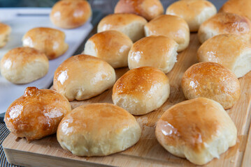 Freshly baked burger buns close up. Freshly baked buns home baking. Handmade.