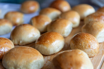 Freshly baked burger buns close up. Freshly baked buns home baking. Handmade.