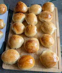 Freshly baked burger buns close up. Freshly baked buns home baking. Handmade.