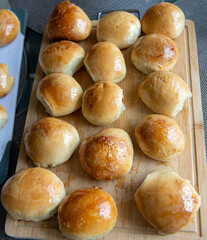 Freshly baked burger buns close up. Freshly baked buns home baking. Handmade.