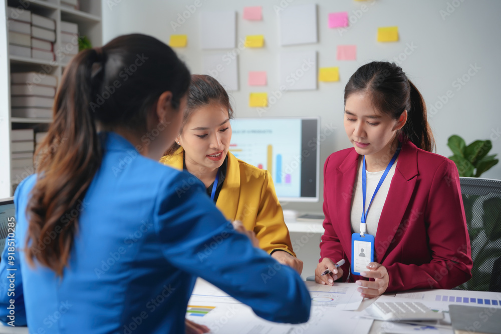 Poster team of businesswomen are having a meeting in the office, analyzing financial data and discussing a 
