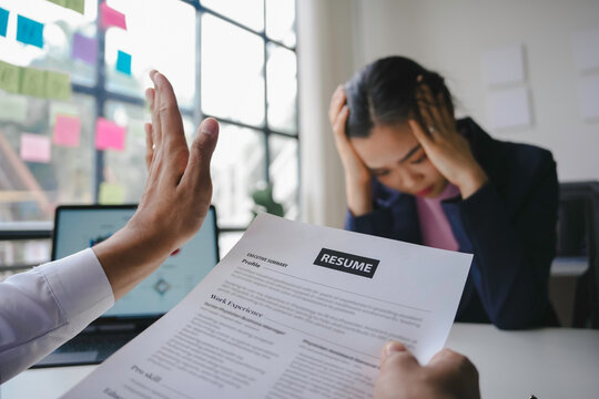 Human resources manager is rejecting a female applicant after a job interview