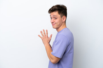 Young handsome Brazilian man isolated on white background scheming something