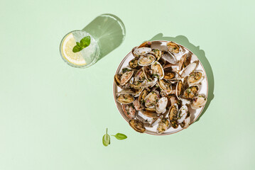 Vongole with basil and onion on a white plate