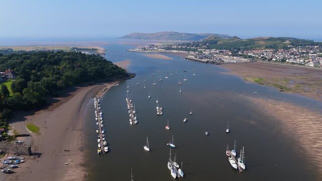 Coastal towns and forest around The Conwy River and estuary in North Wales. Great Orme in background