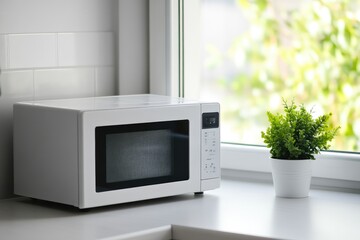 Fototapeta premium White Microwave Oven in Minimalist Kitchen Design