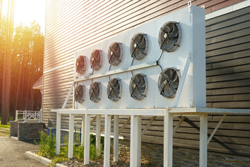 Air conditioning outdoor unit installed outside the building. Air fans of the HVAC system.