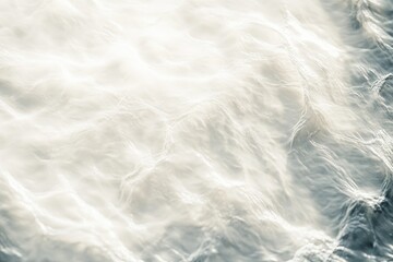 Obraz premium A tranquil white water wave light surface creates subtle ripples, showcasing the beauty of nature's textures and movements in soft diffused light