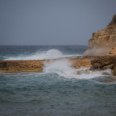 waves crashing on rocks