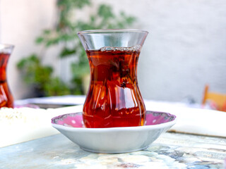 Traditional Turkish Tea Glass, a glass of red Turkish fresh tea