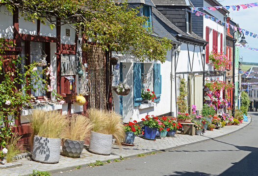 Street decorated with plants, flowers and flags in the old part of Saint Valery sur Somme in France