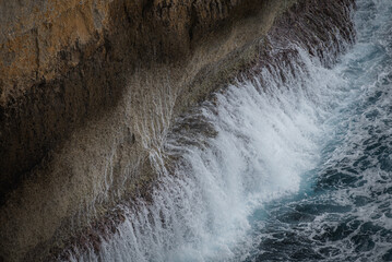water flowing from the waterfall