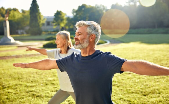 Elderly couple Engaged in Practicing Yoga Outdoors Amidst the Beauty of Nature and Fresh Air