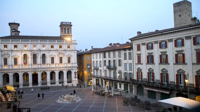 Piazza Vecchia in Bergamo. Library, fountain and historic buildings