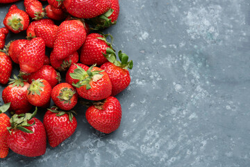 Fresh strawberries on blue background