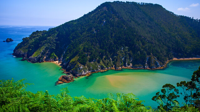Aerial view of river, Atlantic Ocean, and surrounding cliffs. The Tina Menor estuary, Nansa River Mouth into the Cantabrian Sea. Pech&oacute;n, Val de San Vicente, Cantabria, Spain.