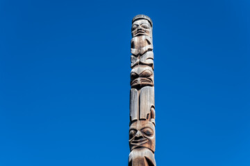First Nations totem pole of Gitxsan natives in Gitanyow or Kitwancool, British Columbia, Canada.	
