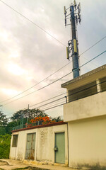 Red white 5G tower radiation in Playa del Carmen Mexico.