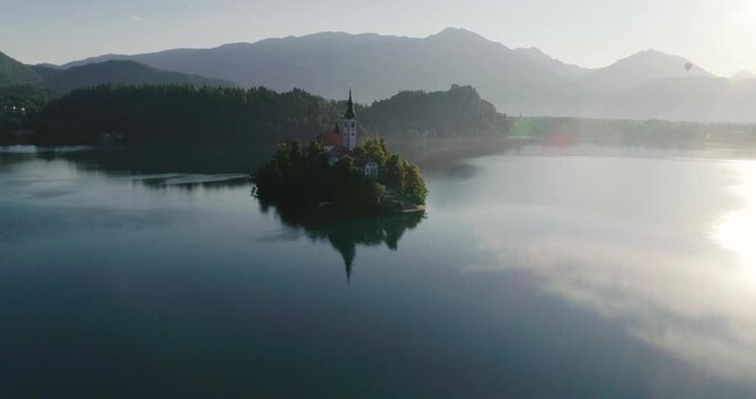 Aerial view, panoramic Bled Lake, beauty heritage in Slovenia. Island with church and castle in the background create a dream setting. View from Ojstrica and Mala Osojnica with the heart-shaped bench.