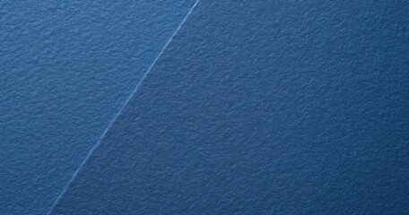 Fototapeta premium Close-up of textured blue construction paper backdrop