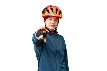 Young cyclist girl over isolated chroma key background points finger at you with a confident expression