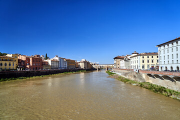 Bridge, tenement houses and historic buildings over the Arno river in the city of Florence