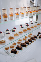 Set of delicious sweet cakes and dessert in the restaurant. Scene is celebratory and festive