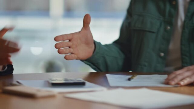 Man hands putting signature on contract at office closeup. Businessman signing